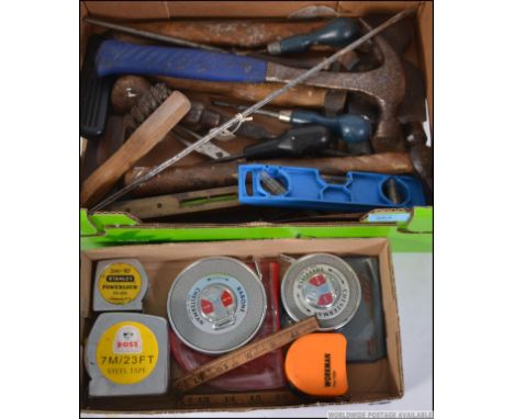 A box of vintage tools and measures . 
