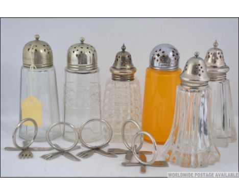 A collection of silver plated and cut glass sugar sifter / casters. 5 cut glass together with an orange glass example. Also 4