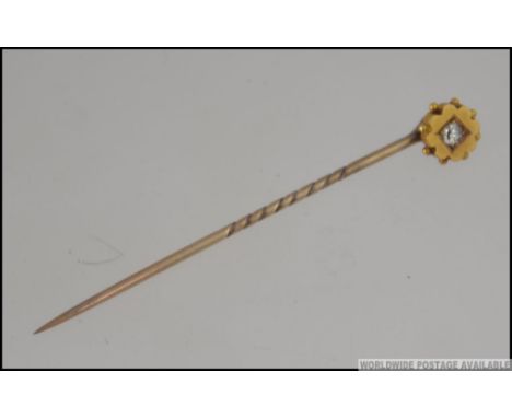 A Victorian 9ct gold and diamond stick pin / hat pin, the diamond approx 6-8pnts. Total weight 1.6g