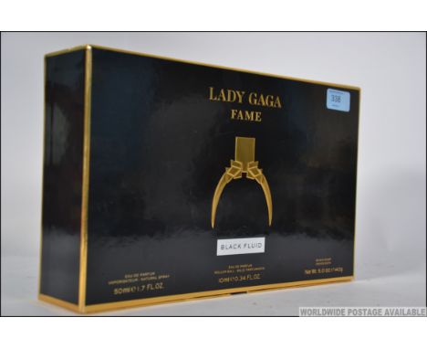 An unused boxed promotional perfume set for Lady Gaga Fame ' Black Fluid ' consisting of Eau De parfum natural spray, Eau De 