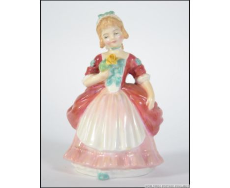 A Royal Doulton figurine entitled Valerie model HN2107 bearing green backstamps to the base. Measures: 13 cms high.
