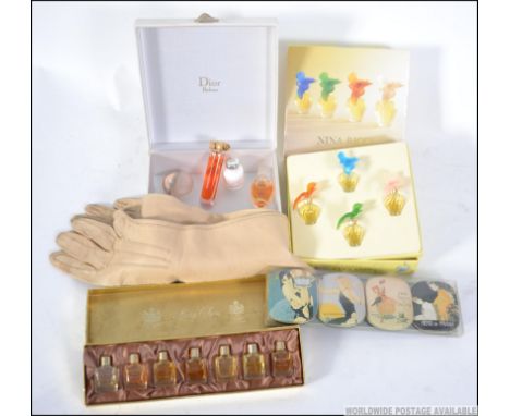 Mixed lot of vintage miniature perfume sets to include Nina Ricci , a set of deco style tinned soaps , 3/4 length kid gloves 