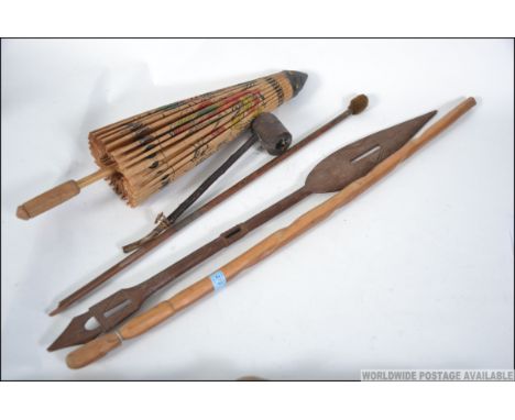 A collection of Tribal African spears - sticks etc together with a Japanese wooden parasol and a wooden smoking pipe. Measure