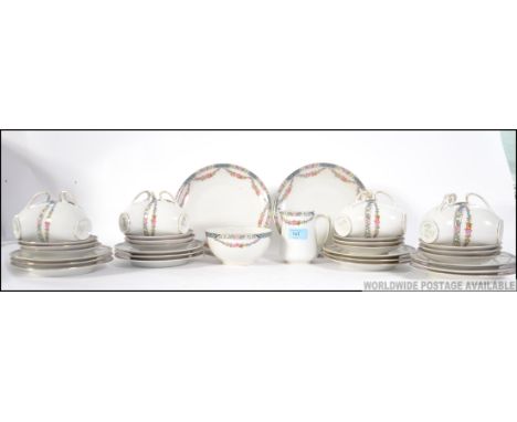 A vintage likely Czech made transfer printed floral dinner / tea service. Floral  borders, with makers marks to underside. 
