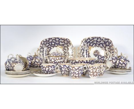 A stunning 19th century aesthetic movement blue and white tea service comprising cups, saucers, plates etc, the blue coral wi