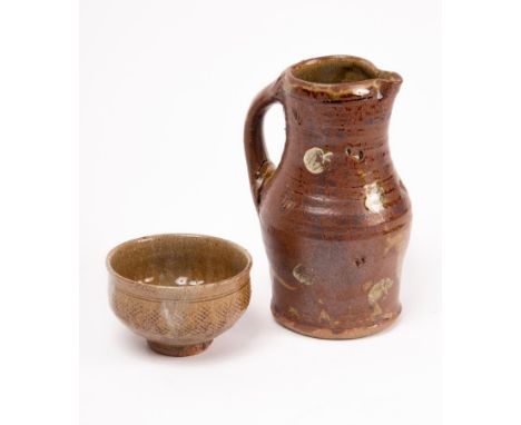 Jim Malone (born 1946) a stoneware tea bowl, circa 1990, with impressed honeycomb design around the body beneath a green ash 