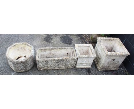 Four assorted reconstituted stone planters, to include; two graduated cubic form planters, 40cm and 30cm high, a trough type 