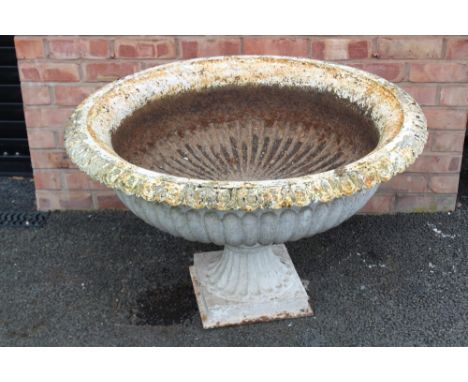 A Victorian cast iron garden urn, of lobed bowl form, with a scalloped rim, 61cm H x 101cm D Condition report: Some general l