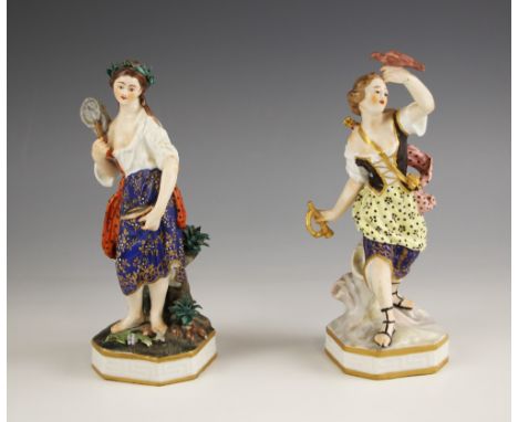 Two Crown Debry figures of maidens early 19th century, one modelled with a net and her catch of fish, the second modelled hol