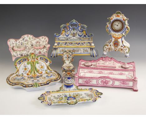 A collection of French faience, 20th century, comprising: a desk stand modelled as a settee, 10cm high, a further example wit