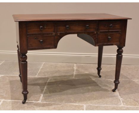 A 19th century mahogany bowfront dressing table, the rectangular moulded top above an arrangement of five cock beaded and ash
