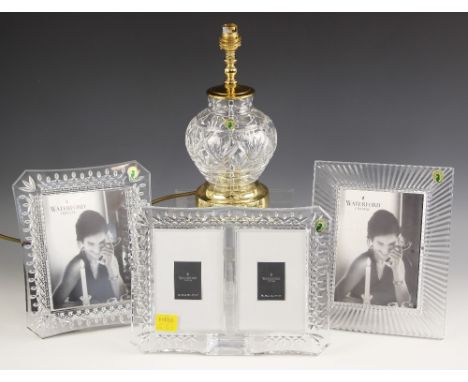 A boxed Waterford Crystal photograph frame, of rectangular form with canted corners, the aperture 18cm x 13cm, 26.5cm x 21.5c