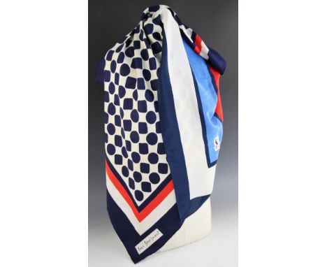 An Yves Saint Laurent silk scarf, designed in navy and cream with coral accent, with rolled hems, 85cm x 85cm, along with a f
