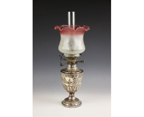 A Victorian silver oil lamp, James Deakin and Sons, Sheffield 1891, the urn shaped body with embossed acanthus decoration and