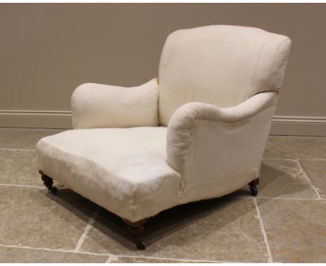 A Victorian club armchair by Howard & Sons, London, late 19th century, the gently arched back extending to down swept padded 