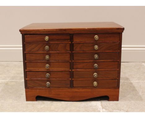 An Edwardian and later walnut specimen/collectors cabinet, formed with an arrangement of twelve baize lined small drawers, ea