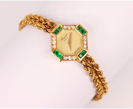 A ladies Chopard emerald and diamond yellow metal wristwatch, the circular champagne coloured dial set to an octagonal case w