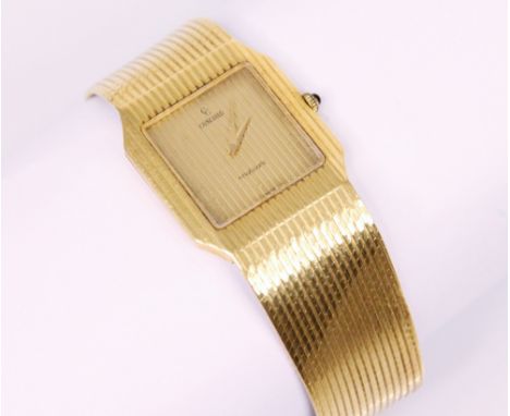 A yellow metal Concord wristwatch, the square champagne coloured dial marked 'Concord, nine quartz' set to a flat grooved cas