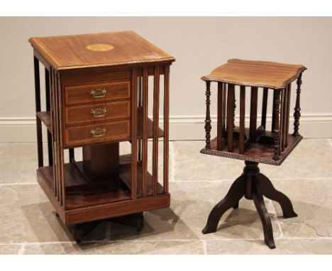 An Edwardian mahogany and satinwood crossbanded revolving bookcase, the square moulded top centred with an inlaid boxwood rou