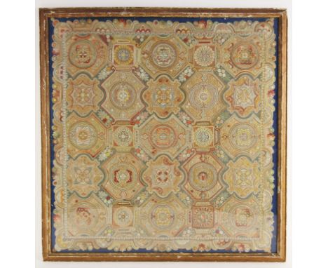 An Italian crewel work panel in the Florentine manner, 19th century, finely worked with tessellating shapes in jewel colours,