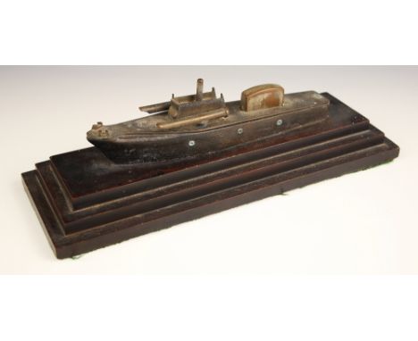 A table lighter modelled as a torpedo boat, 20th century, the wooden hull with metal fittings holding an Orlik flip top light