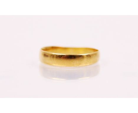 A 22ct yellow gold wedding band, sponsors mark 'H.A' Birmingham possibly 1926, ring size L, 1.8gms 