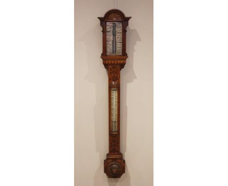 A Victorian carved oak stick barometer, signed Newton & Co, 3 Fleet Street, Temple Bar, London, circa 1870, with a carved lun