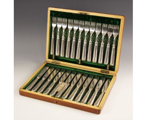 An Edwardian silver cased fish service, Martin Hall and Co, Sheffield 1908, the twenty-four piece canteen with conforming thr