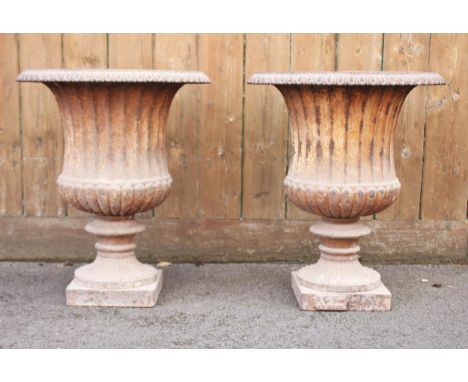 A pair of Victorian cast iron garden campana urns, of typical fluted form, 48cm H x 42cm DCondition reportOverall light corro