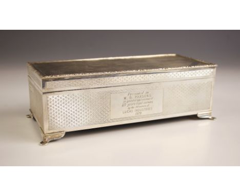 A silver presentation box, Harman Brothers, Birmingham 1978, the rectangular box with engine turned decoration and cast flora