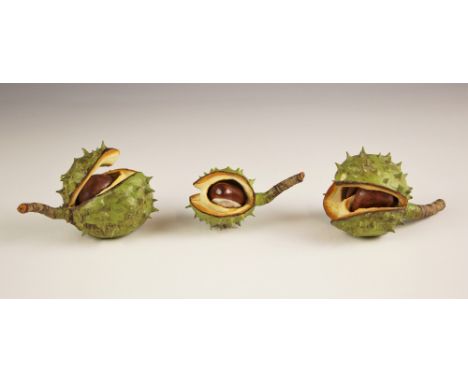 Three Penkridge Ceramics horse chestnut tree seed pods, each modelled slightly open with conkers showing, the largest 9.5cm l