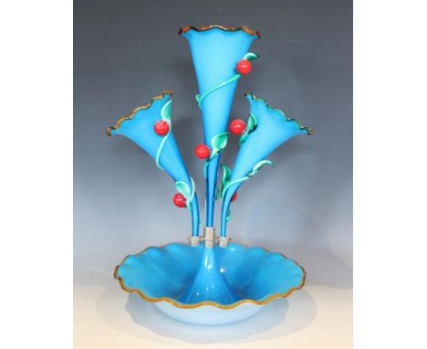 A vibrant blue opaque glass epergne, with a central trumpet over two smaller trumpets, each with flashed white interior, trai