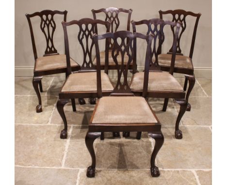 A set of six Chippendale style mahogany ding chairs, early 20th century, each with a pierced splat back over a drop-in seat, 