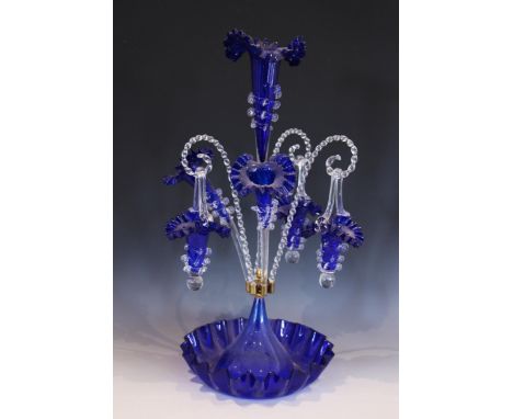 A milk glass epergne, with a central trumpet over three smaller trumpets, all with crimped clear glass rims, 35.5cm high, wit