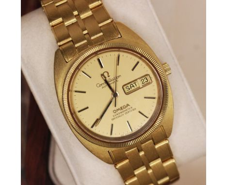 A Gentleman's Omega 18ct gold Constellation day-date chronometer wristwatch, ref 168.045, the circular gold dial with baton n