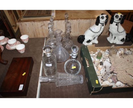 A collection of various decanters and a wine carafe 