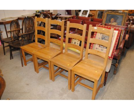 A set of four modern light oak bar back dining chairs