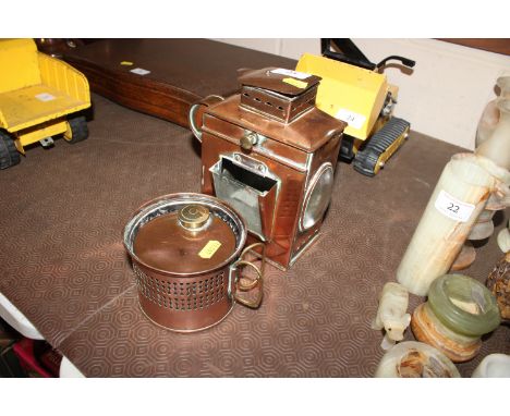 An antique copper lamp; and a copper and brass spirit heater stand 