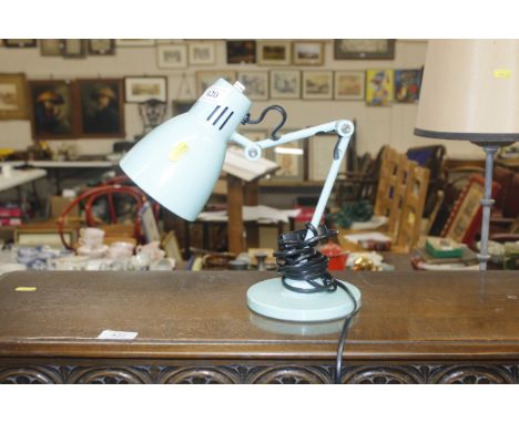 An angle poise style table lamp