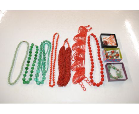 A coral and pearl necklace with 9ct gold clasp and various coral coloured and jade coloured jewellery 