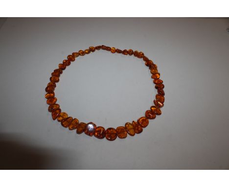 A vintage 24" amber necklace with hidden illusion clasp 