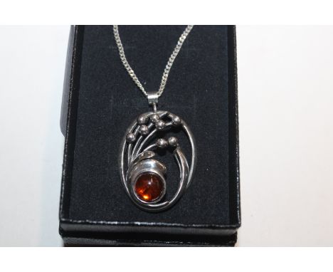 A vintage Sterling silver and amber openwork pendant on necklace, 10gms 
