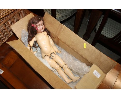 A porcelain headed doll AF, marked SH1909