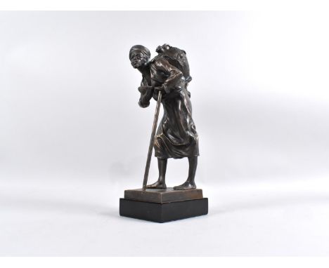 A Bronze Figural Study of Arab Water Carrier with Flask and Staff Set on Rectangular Wooden Plinth, 24cms High 