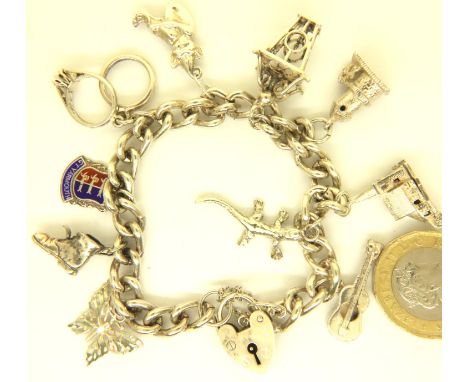 925 silver charm bracelet with ten charms, 43g. P&amp;P Group 1 (£14+VAT for the first lot and £1+VAT for subsequent lots) 