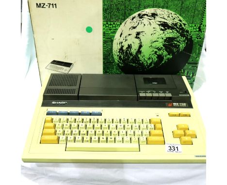 Sharp MZ-700 personal computer c1982, boxed with Basic Applications and Games cassettes, manual and power lead. P&amp;P Group