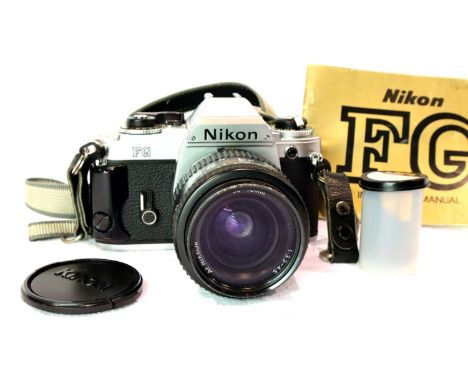 Nikon FG SLR camera with Nikon lens and manual. P&amp;P Group 1 (£14+VAT for the first lot and £1+VAT for subsequent lots) 
