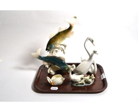 A Karl Ens model of two fish amongst waves, a Herend porcelain model of two swans, A Lladro geese group and a small swan salt