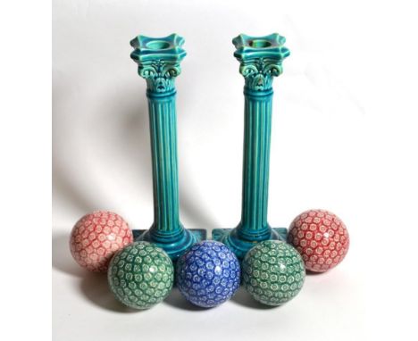 A pair of Burmantoft's turquoise glaze Corinthian column candlesticks; together with five Victorian carpet bowls (7)