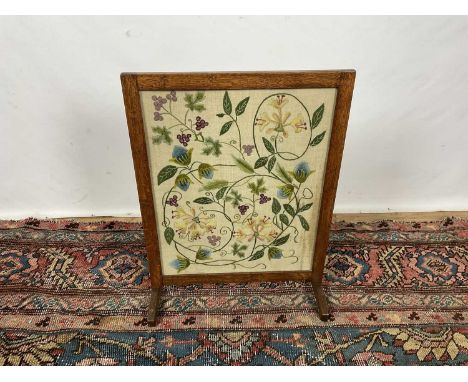 Arts and crafts oak crewel work embroidered fire screen, 65 x 49cm
